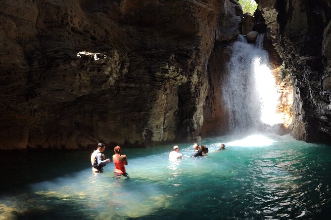 La Leona waterfall Cliffjumping White water Tubbing PrivateTour - Reaching La Leona through rocks, ropes, and caves